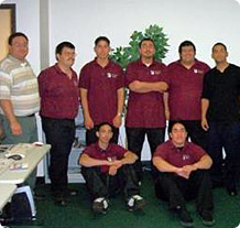 8 men in a Hispanic Chamber of Commerce Broadband program