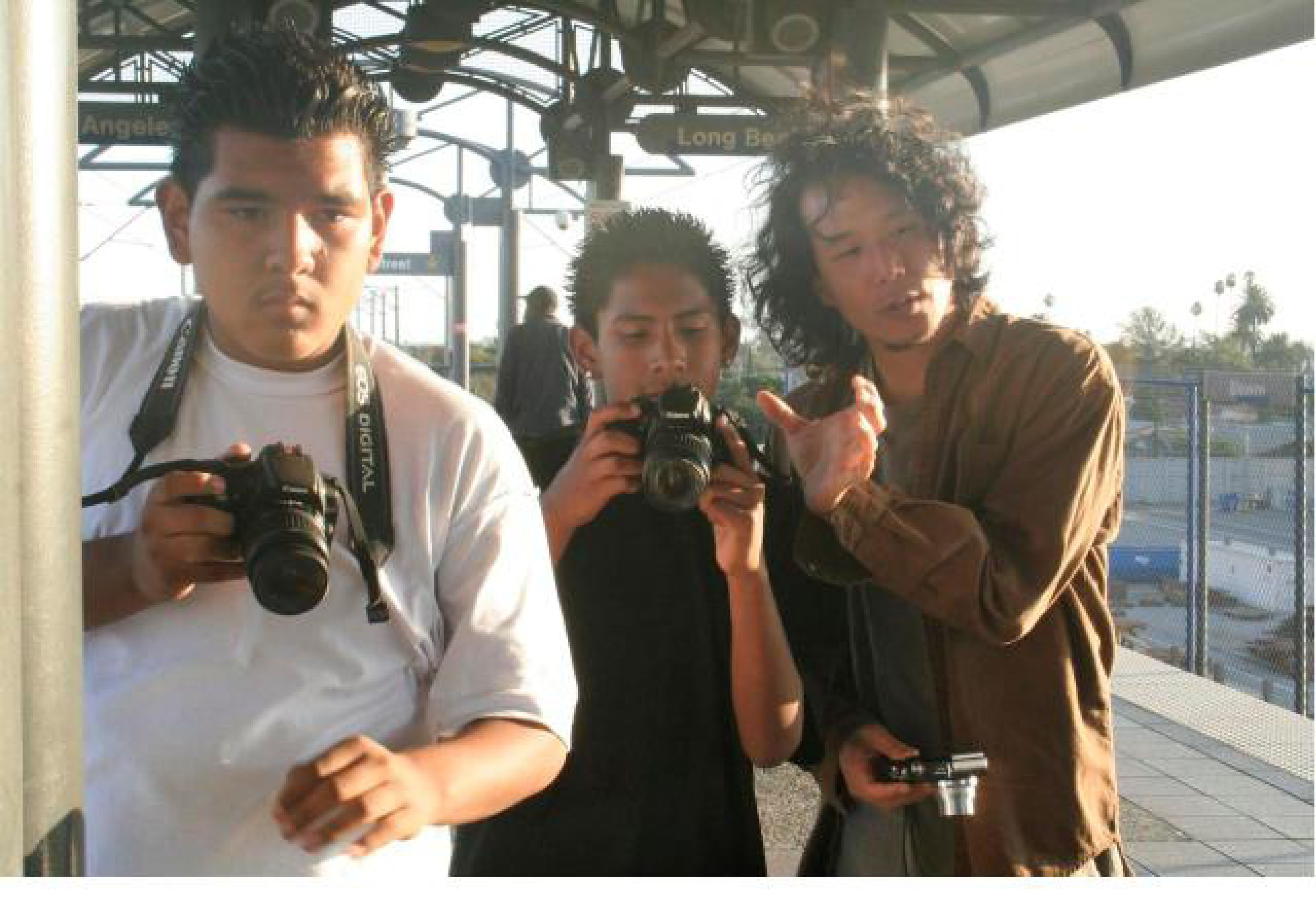 Venice Arts photograph students learning to use SLR cameras