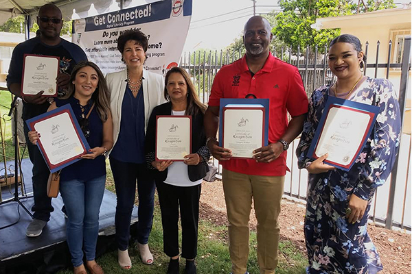 State Senator Connie Leyva (third from left) congratulated Greater Harvest Community Center clients who completed digital literacy training at the Housing Authority of the County of San Bernardino.